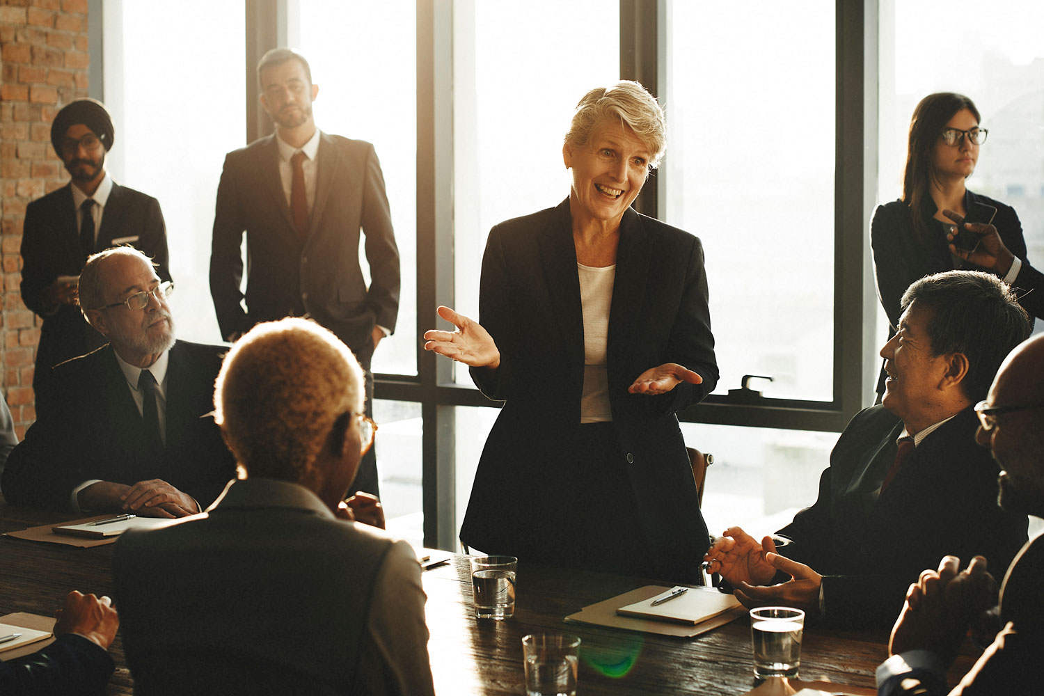 Group of senior professionals at conference table