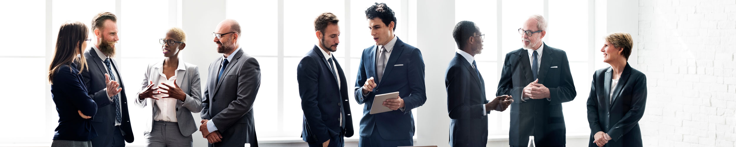 group of corporate executives talking in conference room group of corporate executives talking in conference room