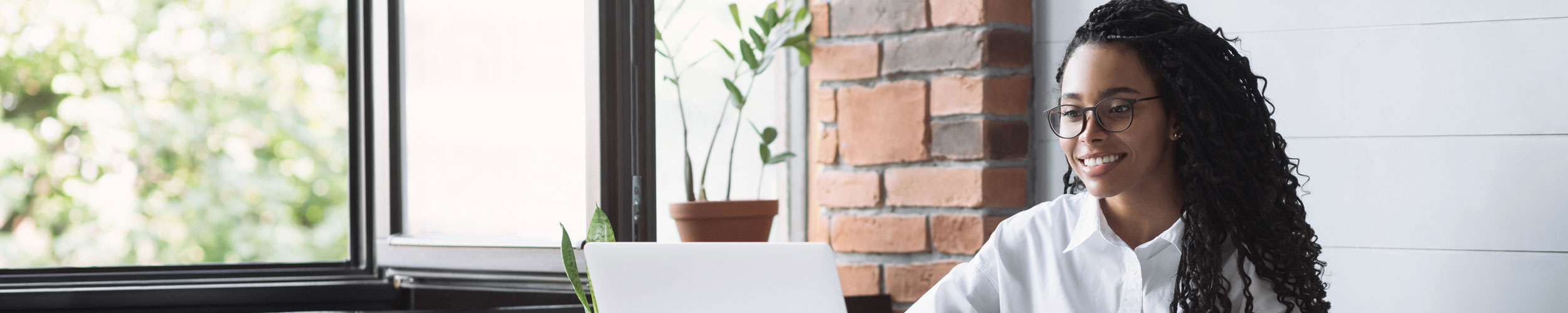 young woman with laptop in casual setting