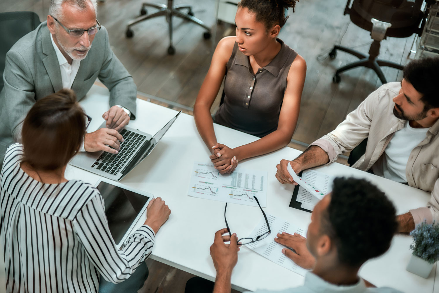 group of professionals at conference table