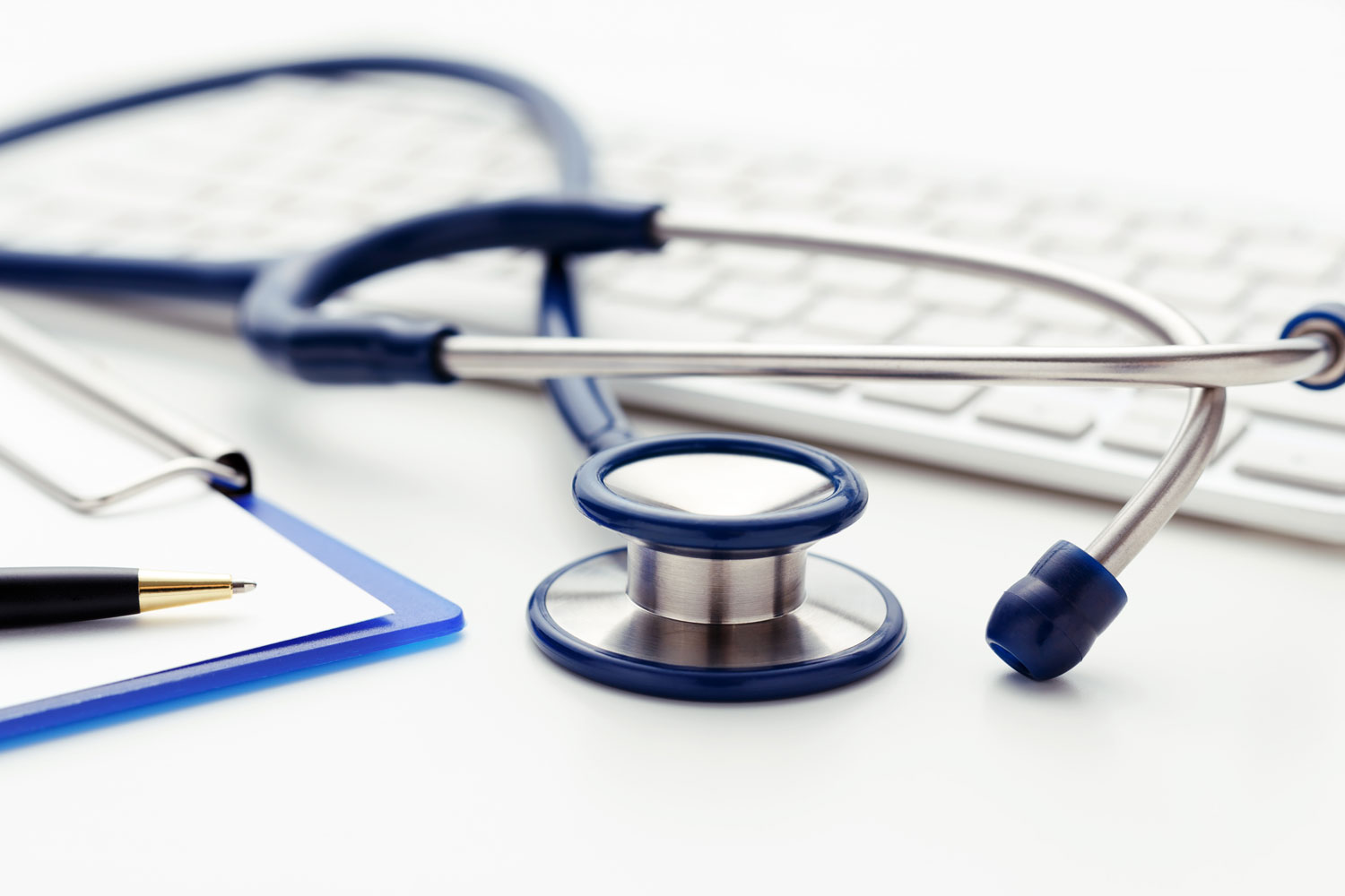 closeup of stethoscope and computer keyboard