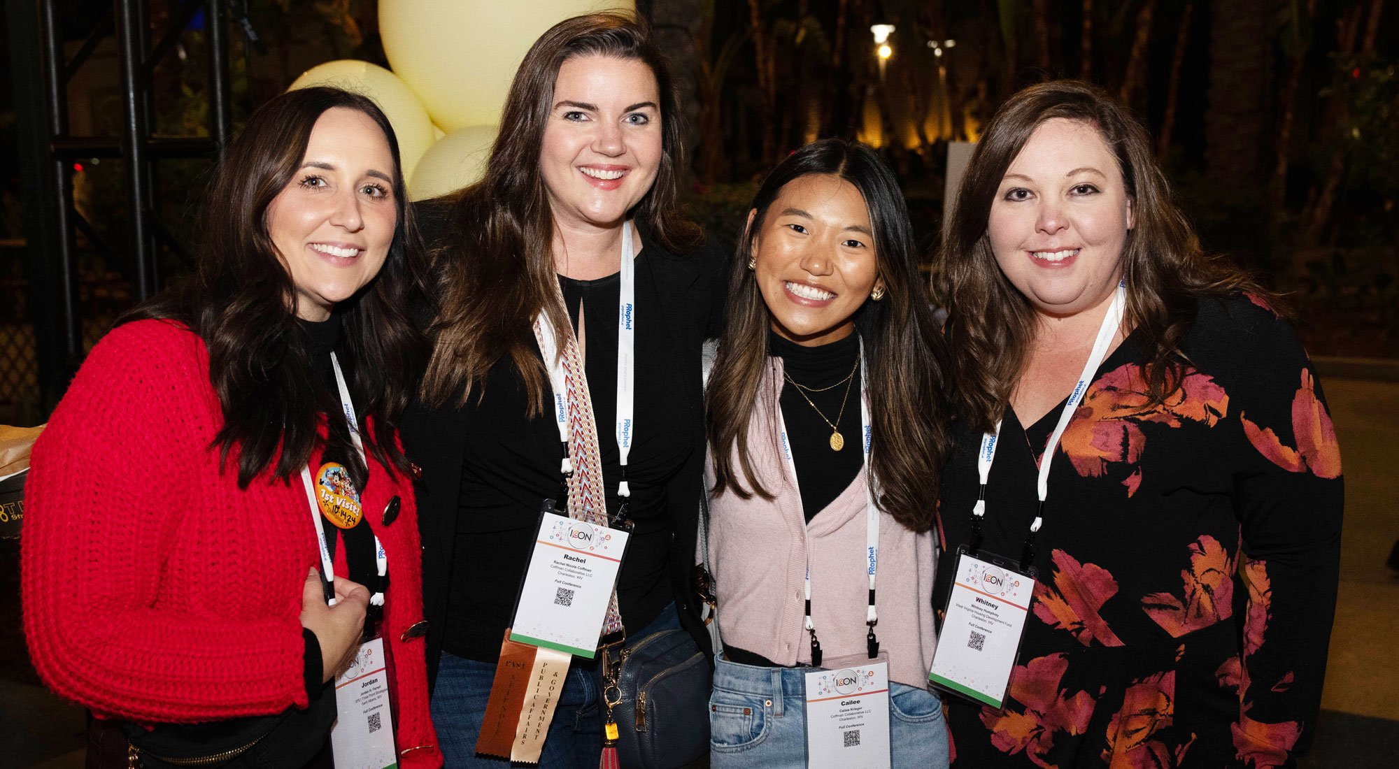 four ICON attendees with conference badges