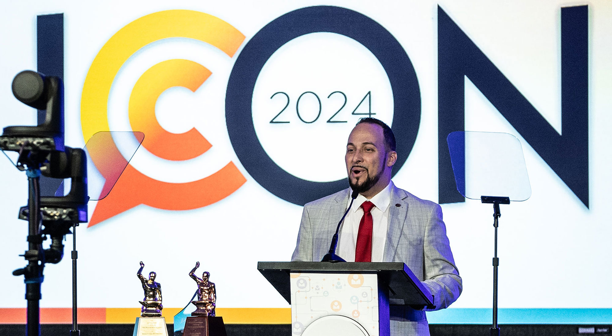 Joseph Abreu at podium in front of ICON banner