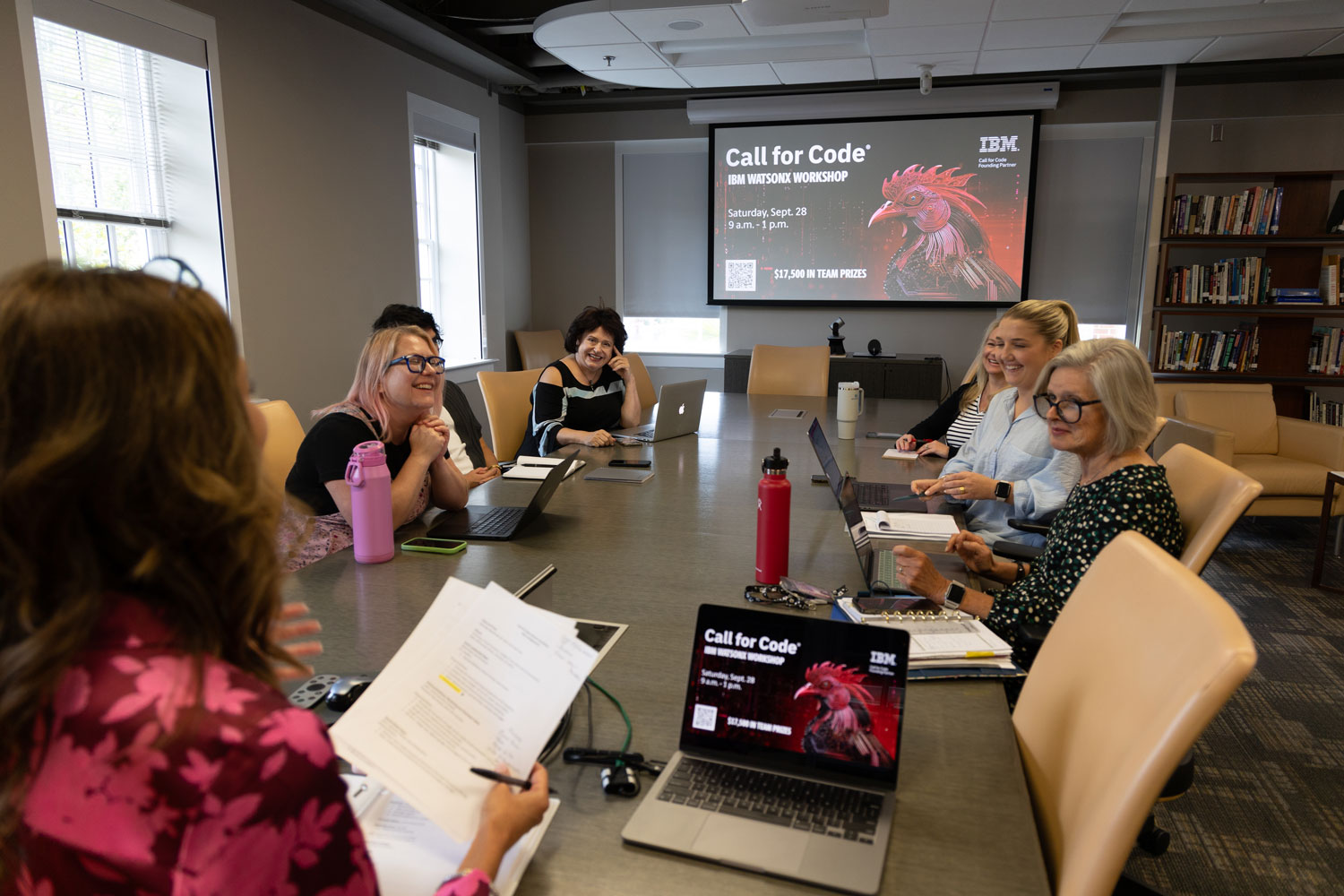 young adults at conference table young adults at conference table
