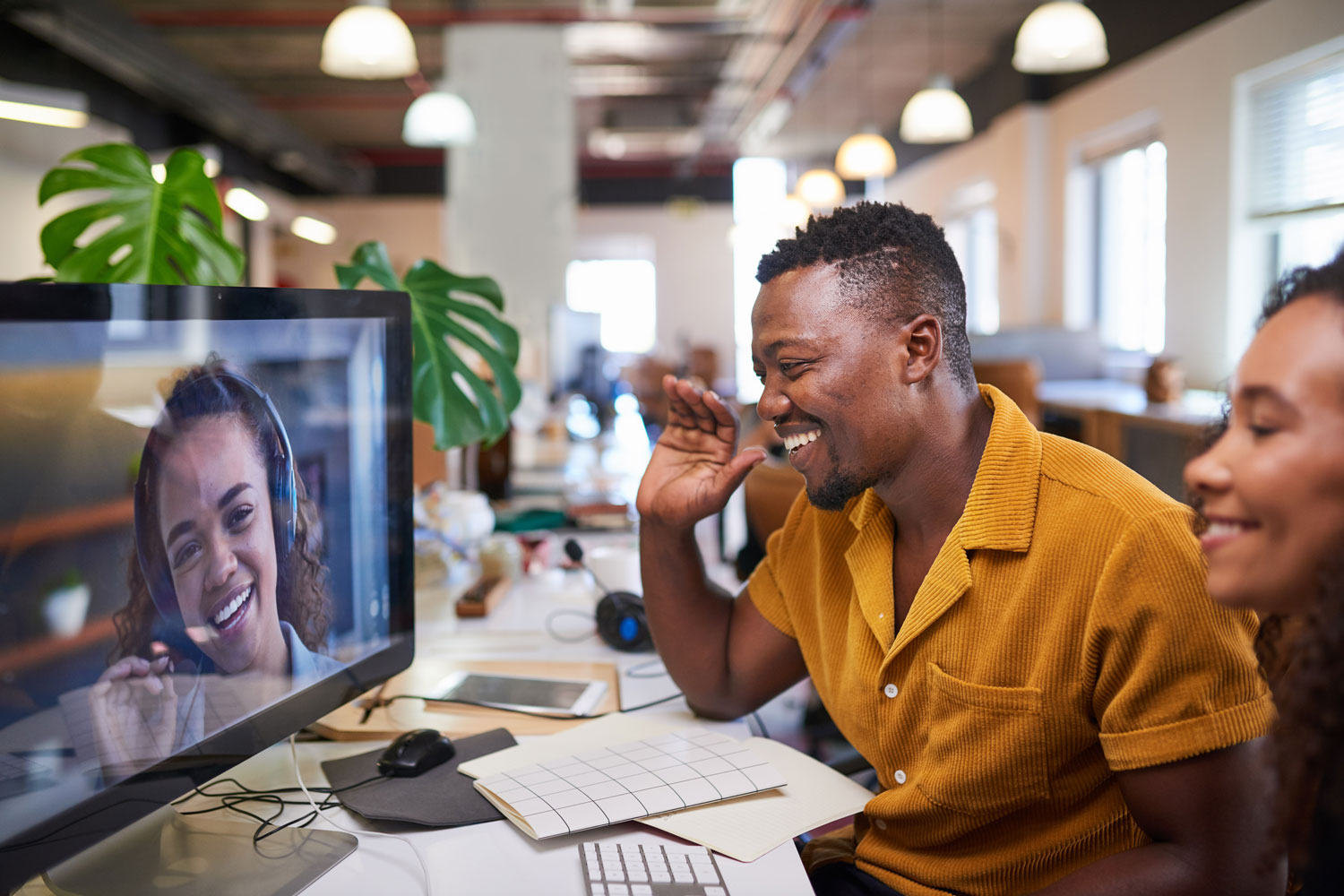 workers in office and on screen