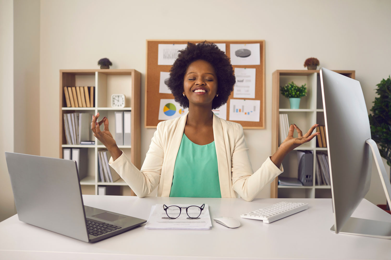 woman at laptop in zen position